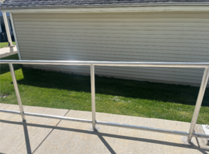 An anodized aluminum hand rail on Kendal’s campus